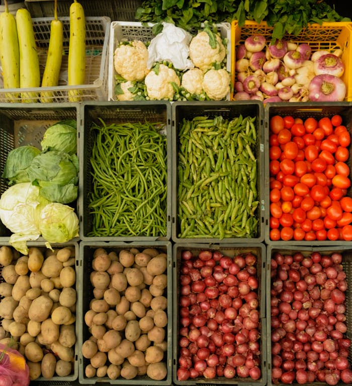 Colorful assortment of vegetables in baskets at a local farmer's market.